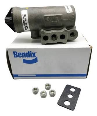 Válvula de freno de aire Bendix con tuercas y junta en una caja.