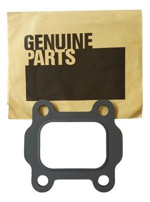 Junta gris con centro rectangular, fondo de sobre marrón con la leyenda “GENUINE PARTS”.