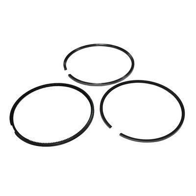 Tres anillos de pistón negros con espacios.