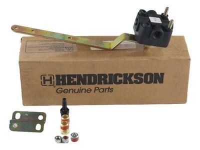Kit de repuestos originales Hendrickson. Válvula de aire negra con brazo amarillo, piezas pequeñas y caja.