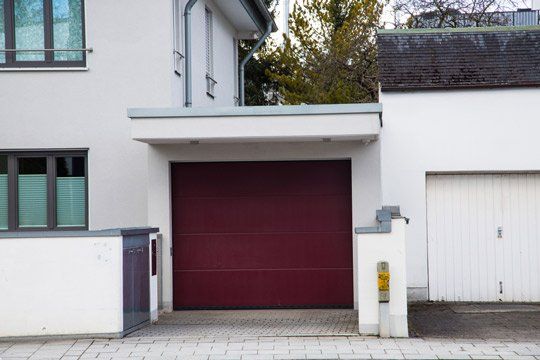 Modern Garage with Wine Red Garage Door — Garage Doors Townsville, QLD