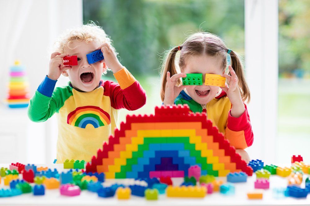 Little Girl And Curly Boy With Educational Toy Blocks — Early Childhood Education in Central Coast, NSW