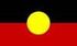 A red , black and yellow flag with a yellow circle in the middle.