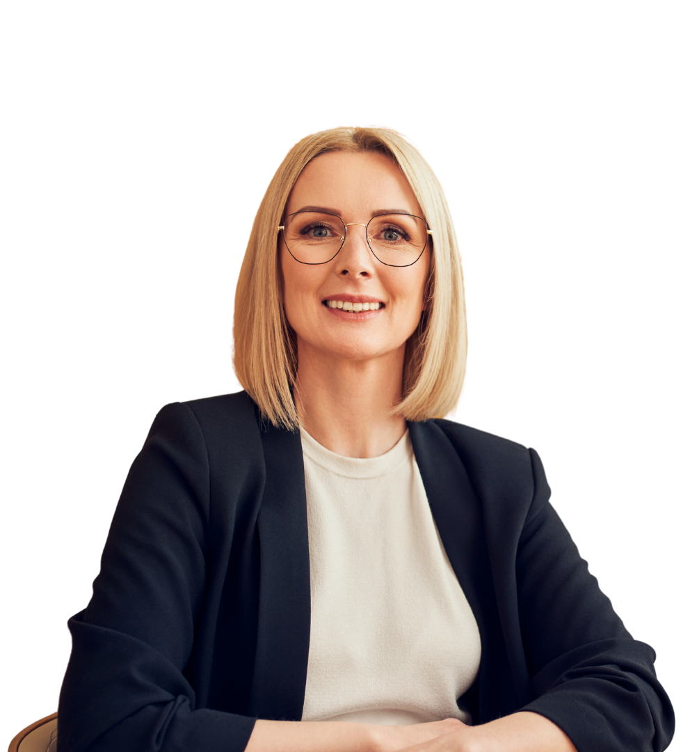 A woman in a black jacket smiling.