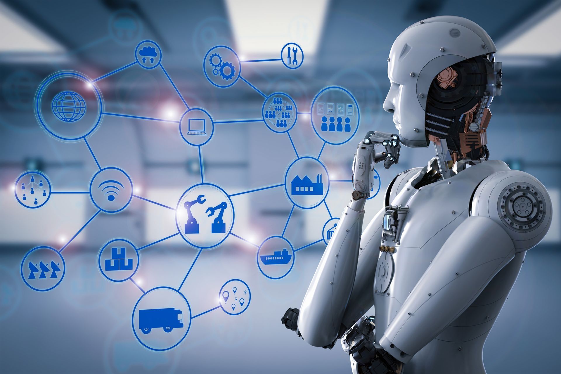 A robot is standing in front of a screen with icons on it.