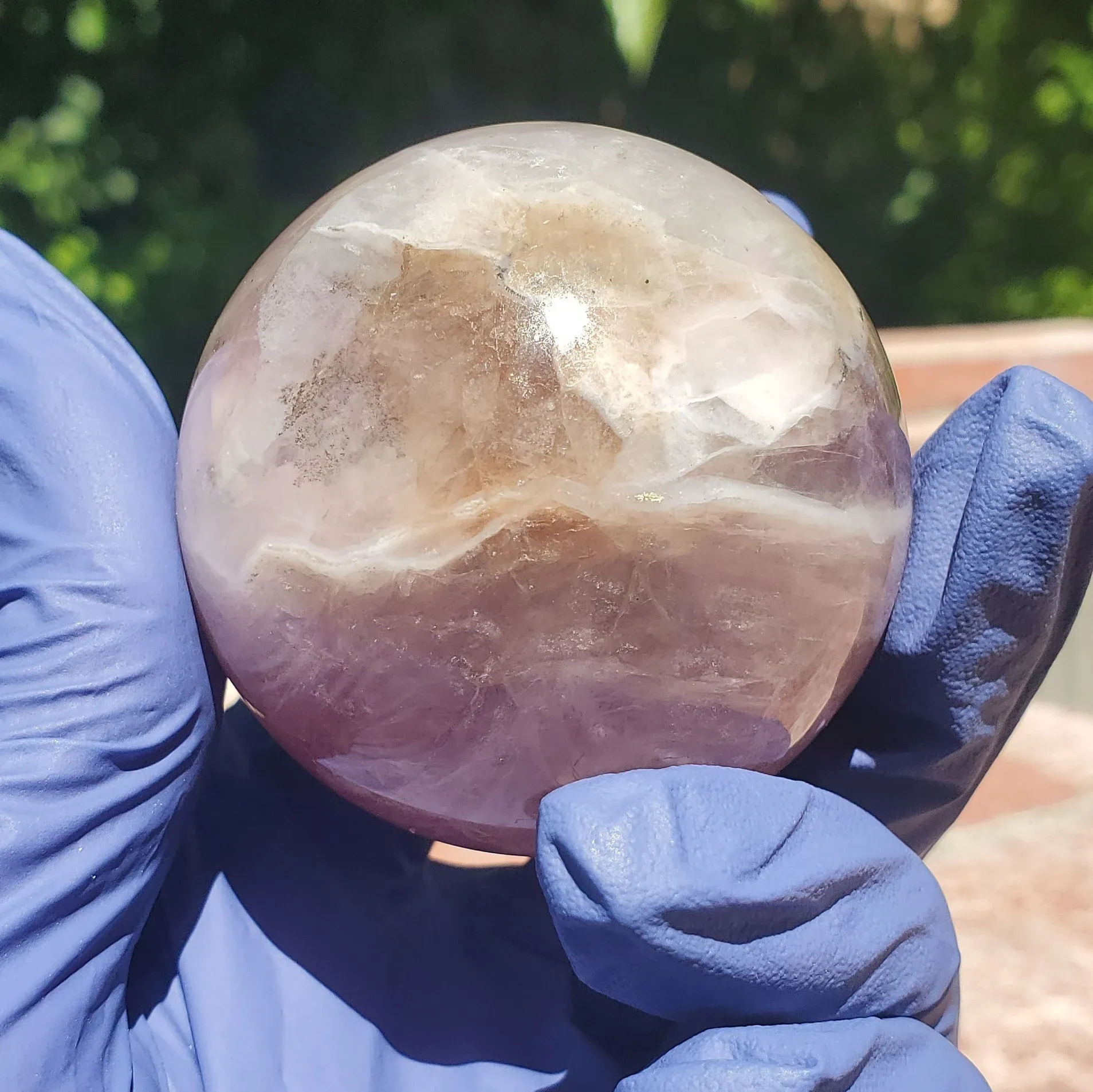 Polished Purple fluorite with a banding smokey white mixture iron and rainbow inclusions 234g