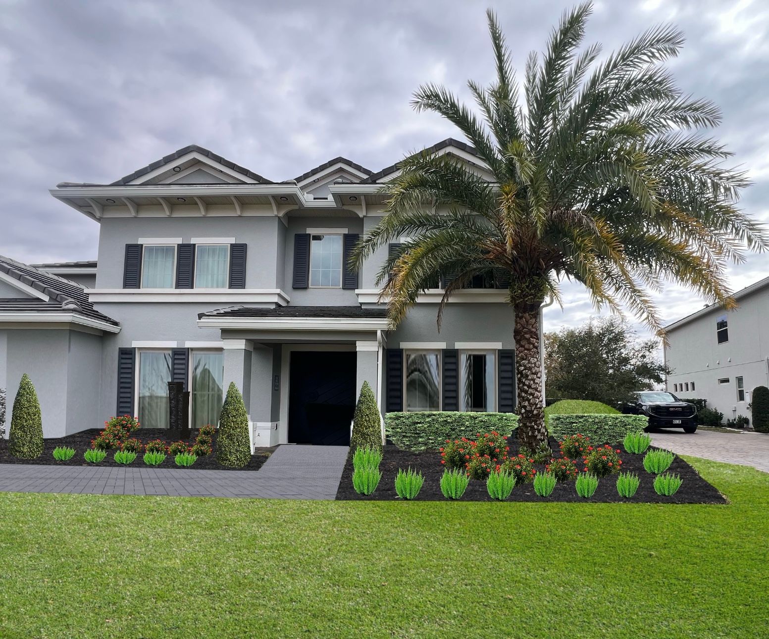 Gray two-story house with palm tree in front, dark shutters, manicured lawn with landscaping. Overcast sky.
