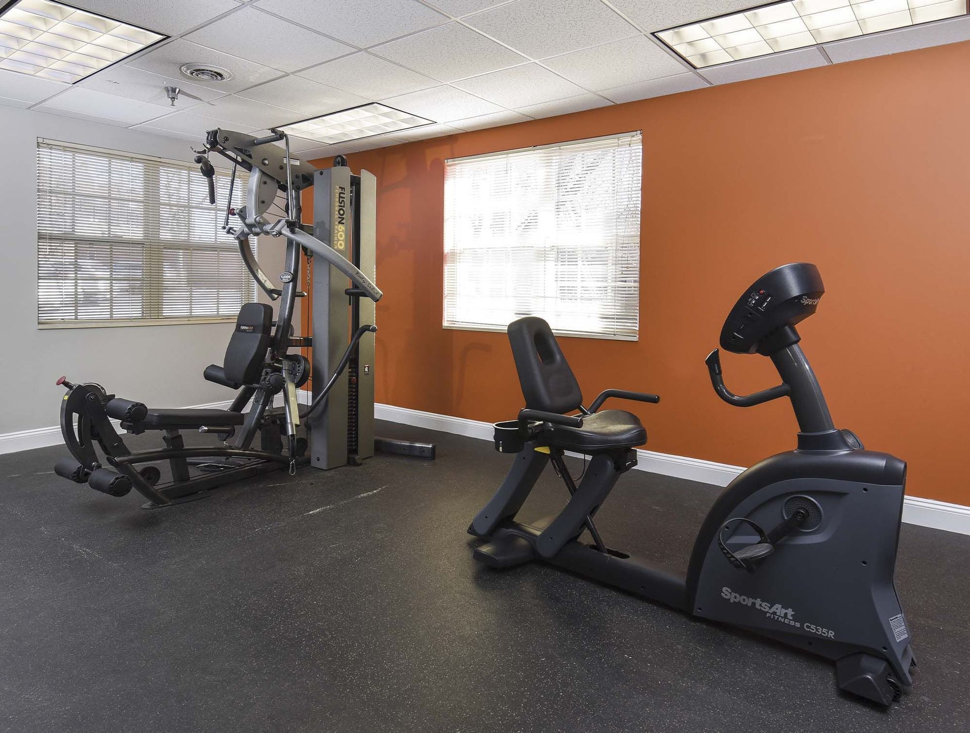 Interior gym in an apartment community with cardio machines and weight equipment at The Alden South Hills in Pittsburgh, PA.