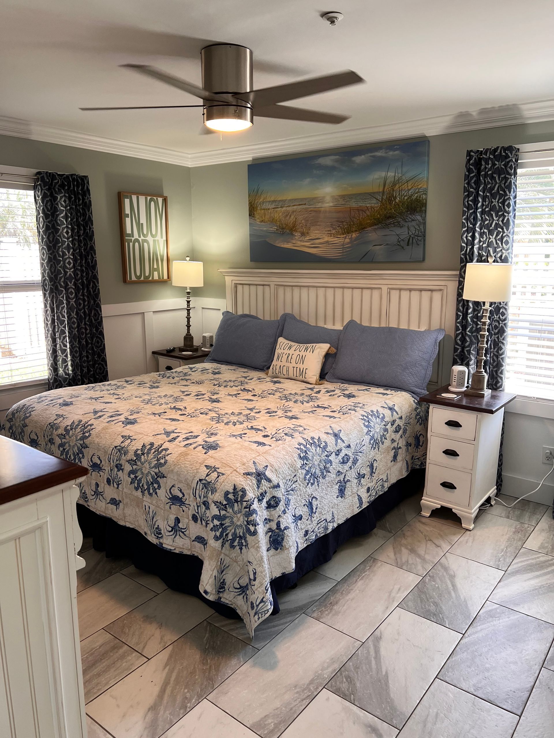 A hotel room with two beds and a chair
