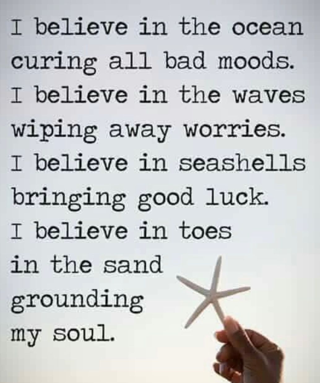 A person is holding a starfish in front of a quote that says 