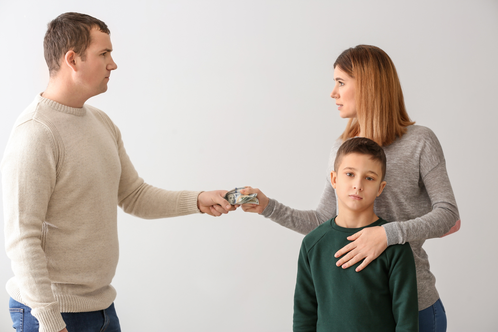 A paper chain of a family holding hands.