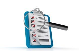 a magnifying glass over a checklist on a clipboard