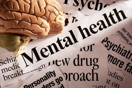 Brain resting on a newspaper headline that reads