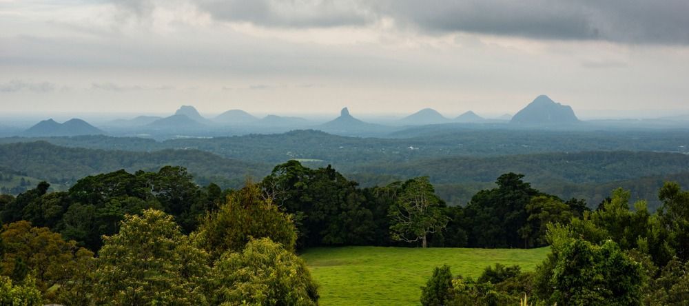 Distant Mountains Above A Green Valley — Superstretch300 Limousines In Sunshine Coast, QLD