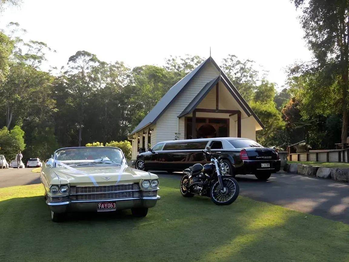 A White Car is Parked in Front of a Small Church — Superstretch300 Limousines In Maroochydore, QLD