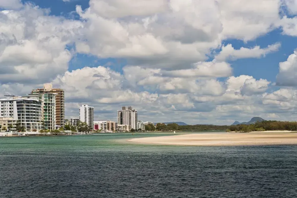 A Large Body of Water in Maroochydore With Buildings in the Background — Superstretch300 Limousines In Sunshine Coast, QLD