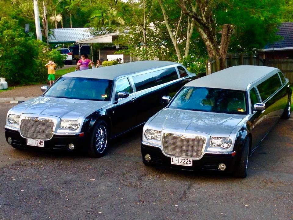 Two Limousines Are Parked Next to Each Other in a Parking Lot — Superstretch300 Limousines in Sunshine Coast, QLD