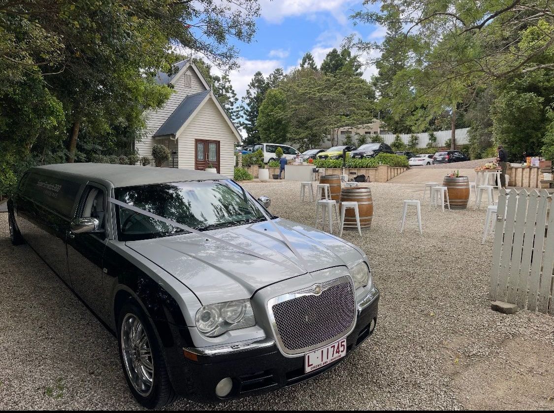 Black And Silver Limousine Parked Near A Small Chapel — Superstretch300 Limousines In Mooloolaba, QLD