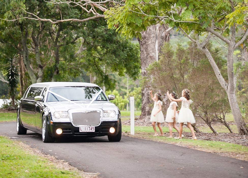 Wedding Limousine With Three Girls on the Side of the Road — Superstretch300 Limousines in Sunshine Coast, QLD