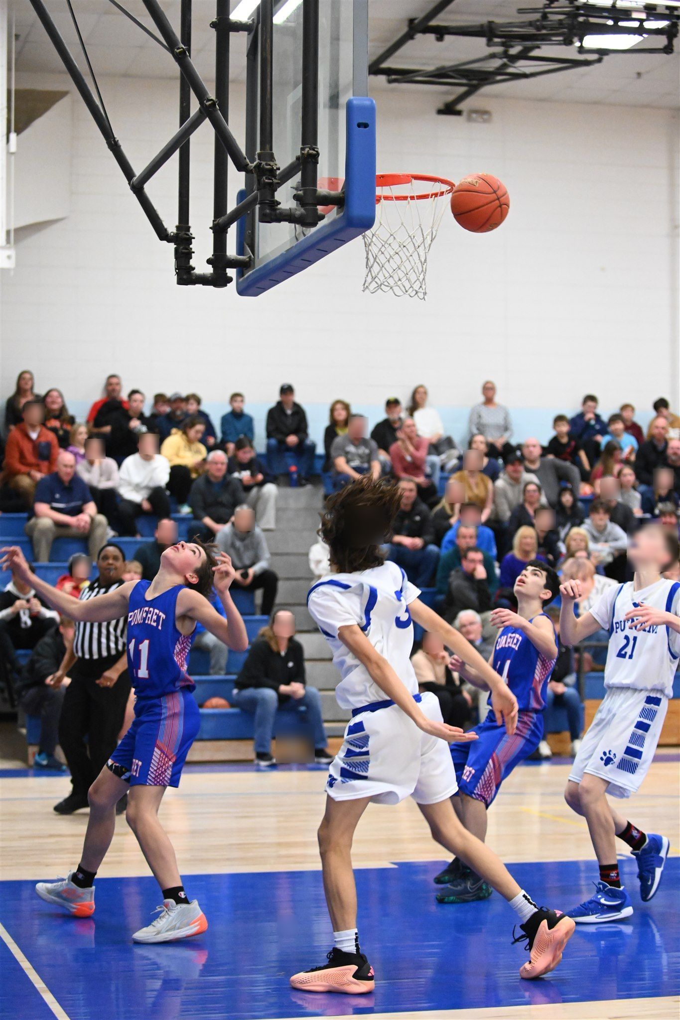 members of the 2023-24 boys basketball team on the court