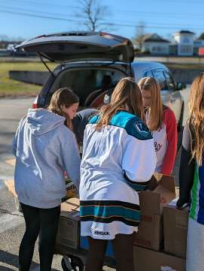 NJHS unloading porduct for the Holiday Store