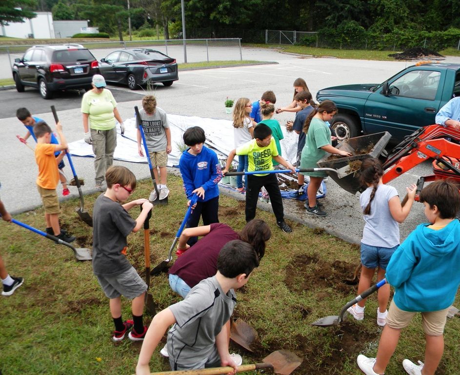 Photo of sixth grade students preparing a rain garden.