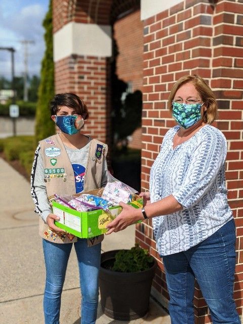 Girl Scout Emily Costa donating masks she made during COVID