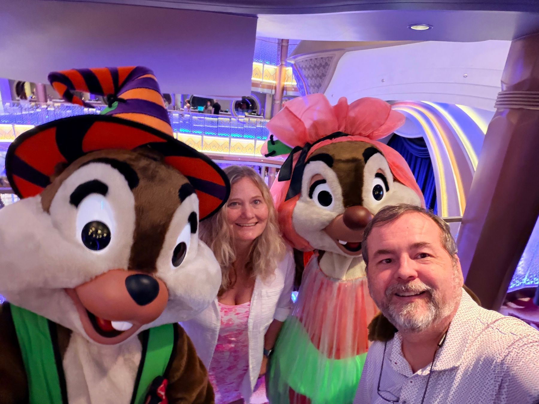 Jesse and his wife with Chip and Dale in Halloween costumes