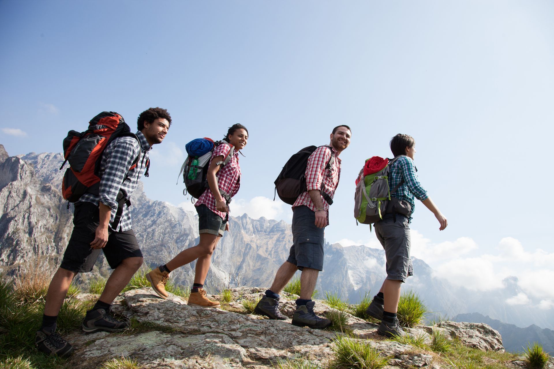 A group of people are hiking up a mountain.
