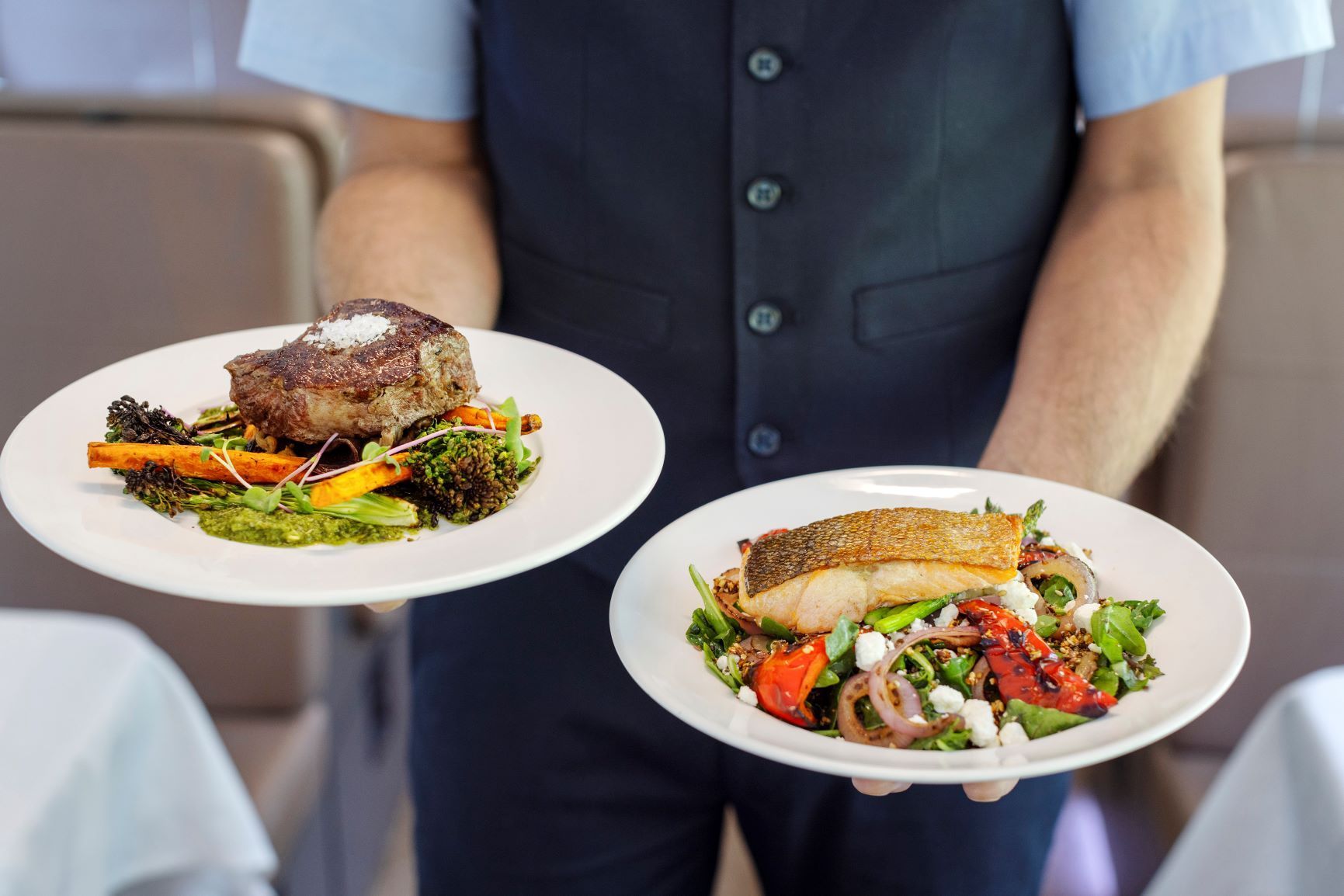 Guests enjoying dining aboard Rocky Mountaineer GoldLeaf Service