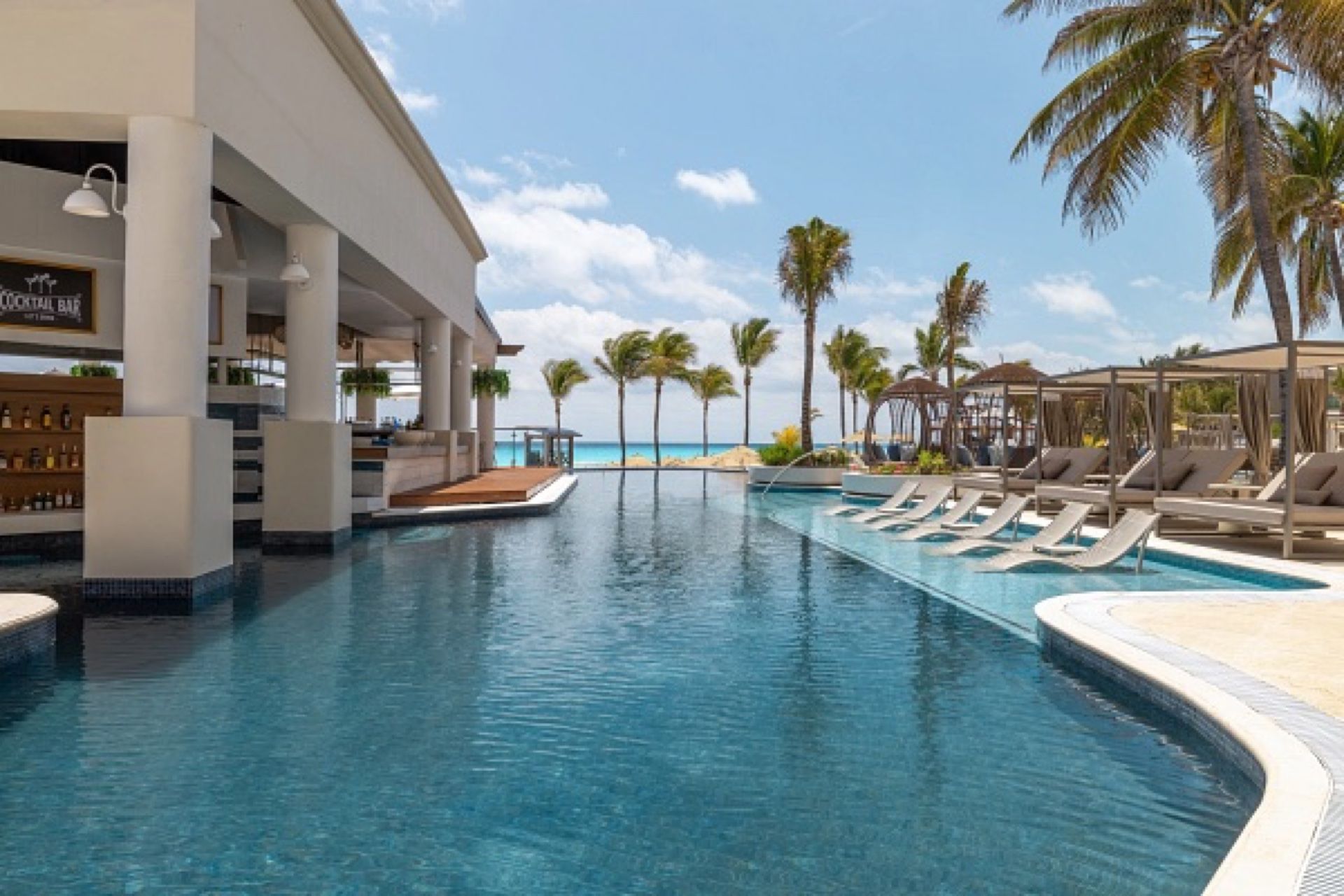 A quiet Hyatt Zilara pool overlooking the beach