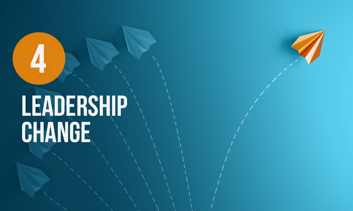Leadership Change A paper airplane is flying through the air with the words