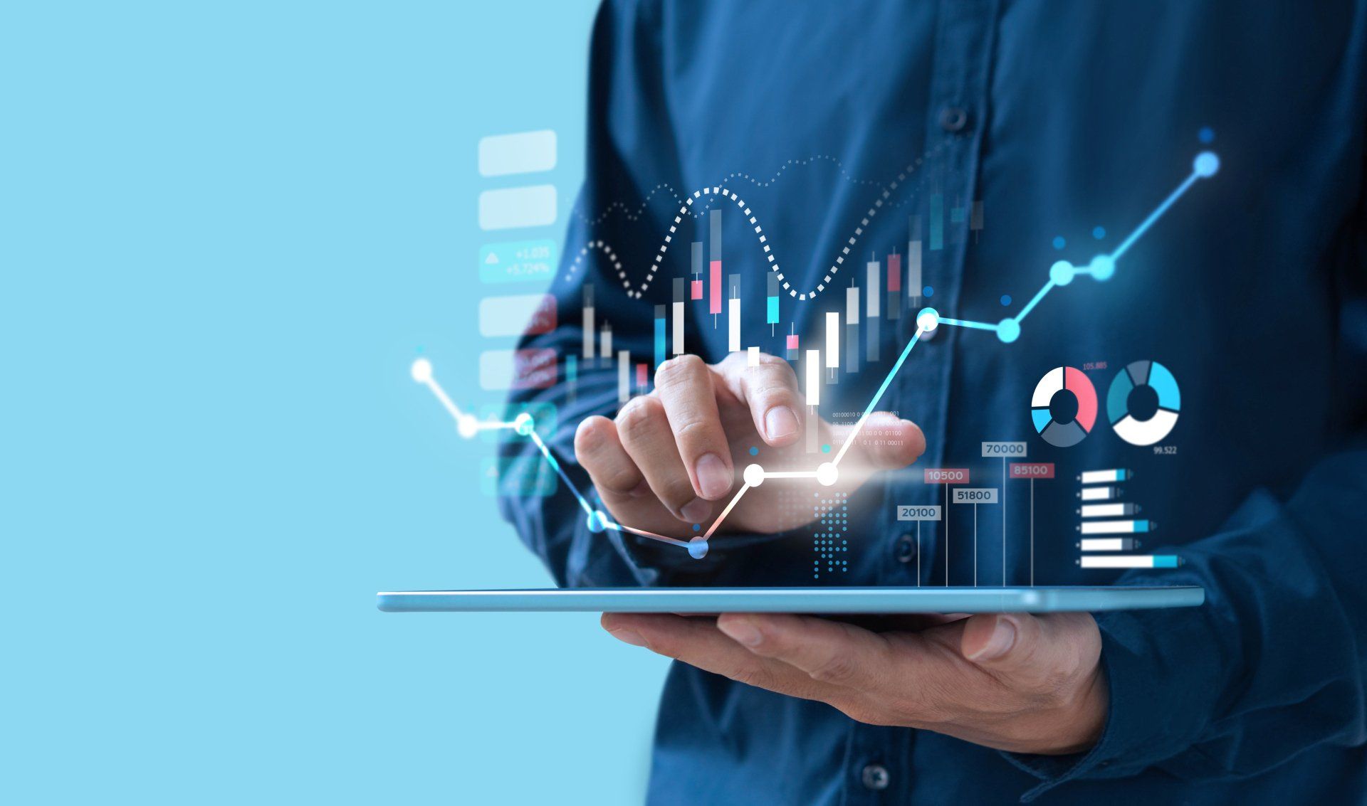 A man is holding a tablet with a graph on it.