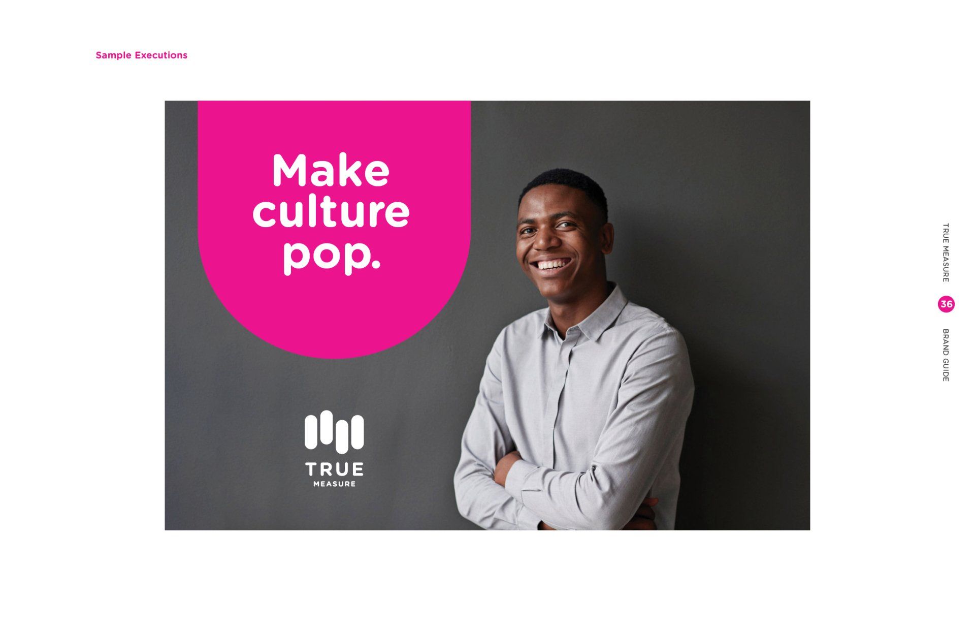 A man is standing in front of a pink sign that says `` make culture pop ''.