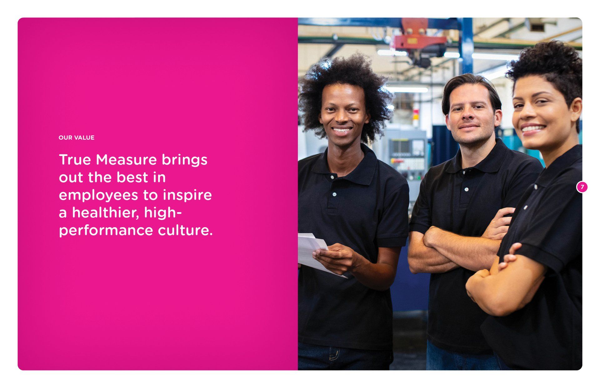 A group of people standing next to each other in a factory.