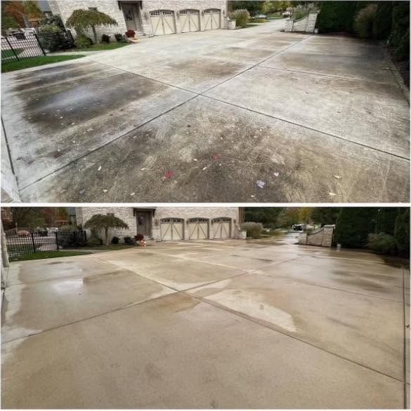 Before-and-after view of a cleaned concrete driveway with dark stains removed
