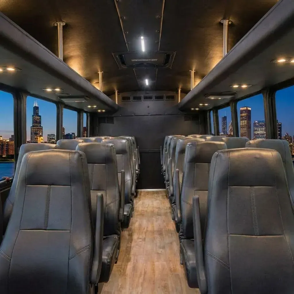 Interior of a passenger bus with rows of black seats, wooden floor, and a city skyline visible through the windows.