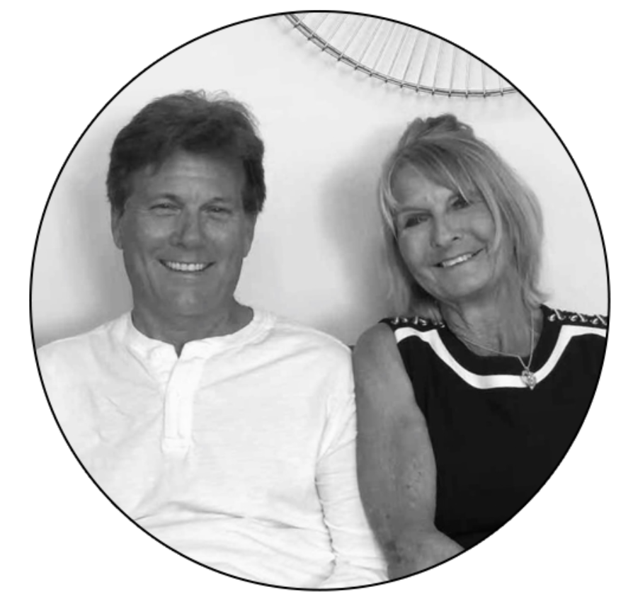 A black and white photo of a man and woman smiling