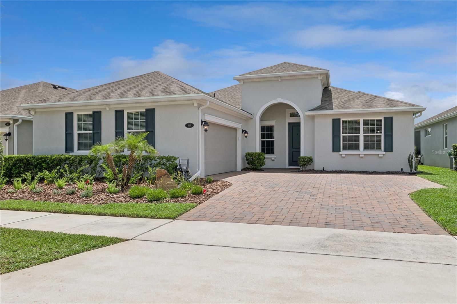 HOME WITH A BEAUTIFUL BRICK PAVED DRIVEWAY