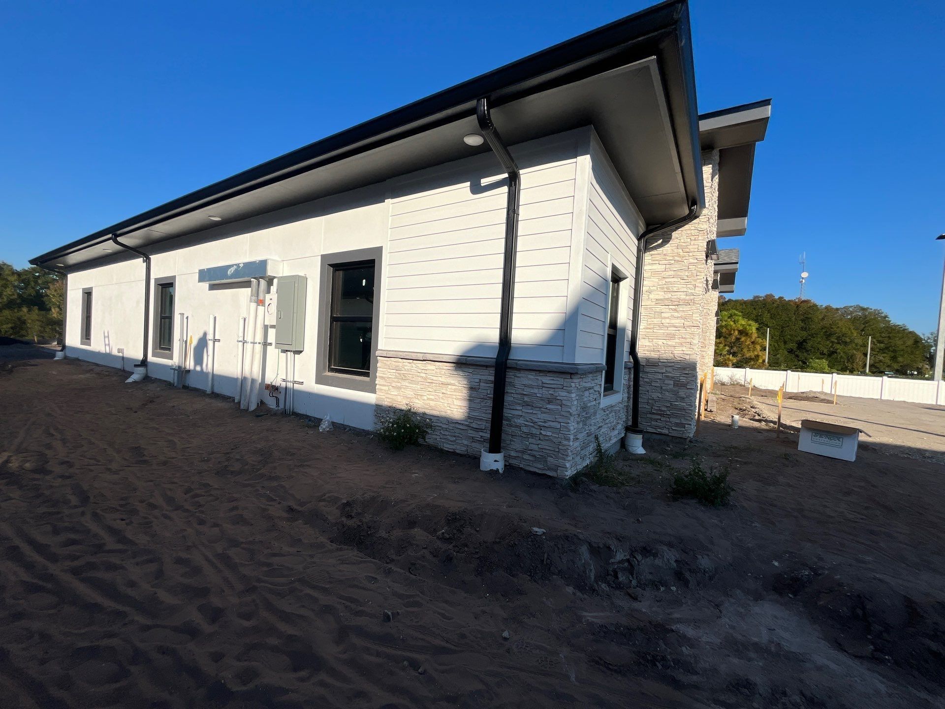Black gutter and downspout installation in Land O’ Lakes, Florida
