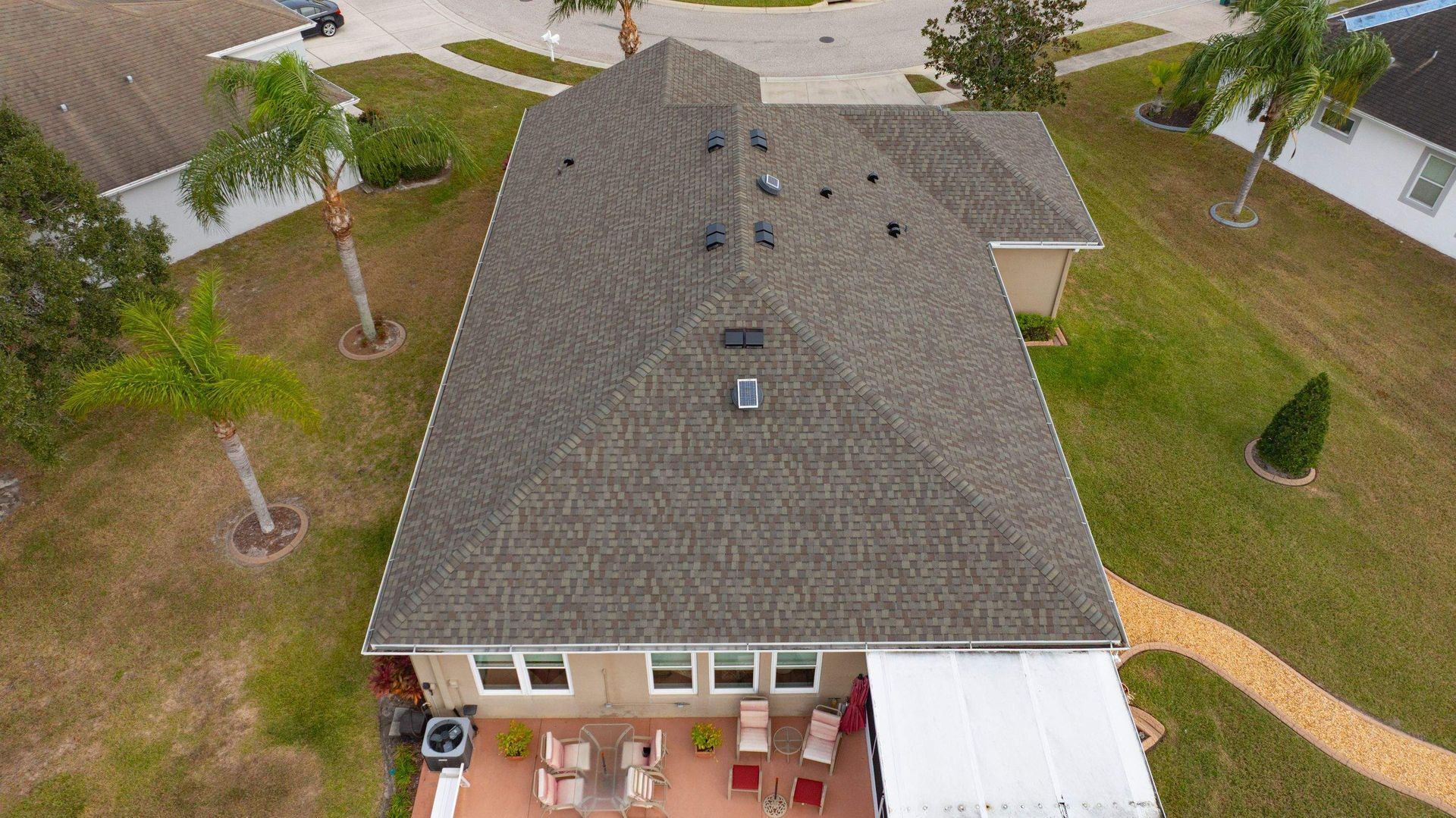 Aerial view of a new CertainTeed Landmark Weathered Wood architectural shingle roof installed on a home in Palm Cove, Wesley Chapel, FL.