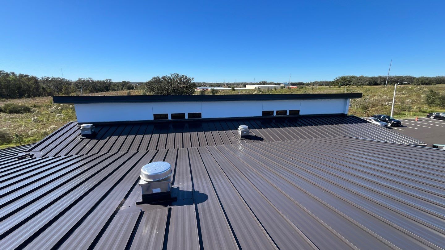 Commercial soffit, fascia, and standing seam metal roof installation at ACP Office Building in San Antonio, FL.