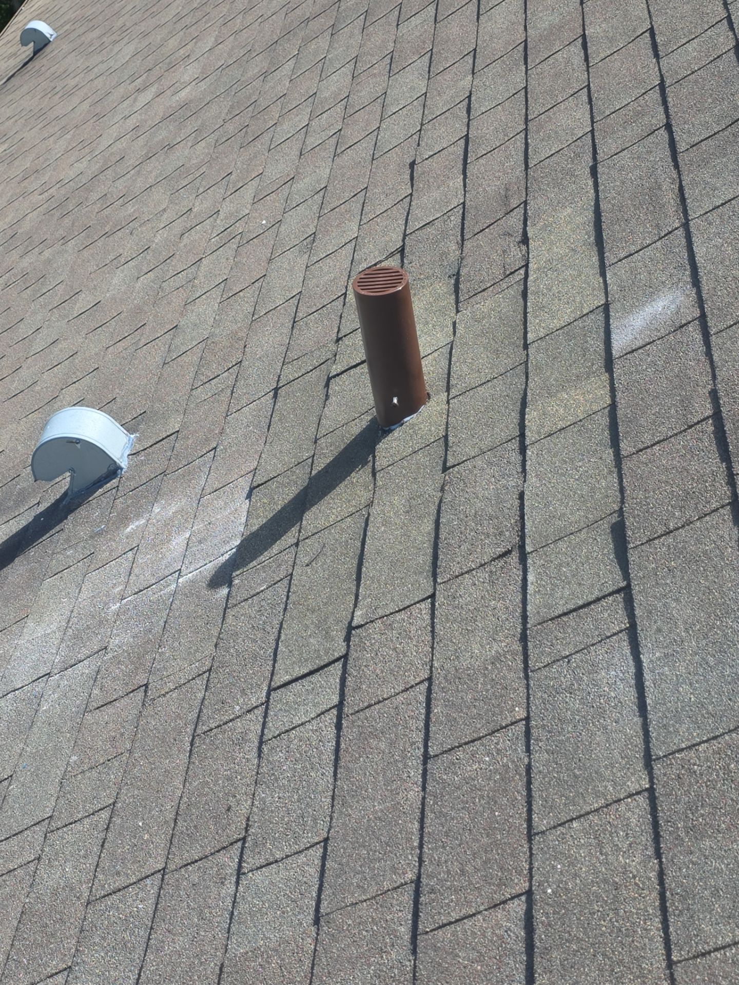Completed shingle roof repair in Wesley Chapel with a new pipe boot, properly tied-in shingles and a squirrel guard installed to help protect the pipe from future animal damage.