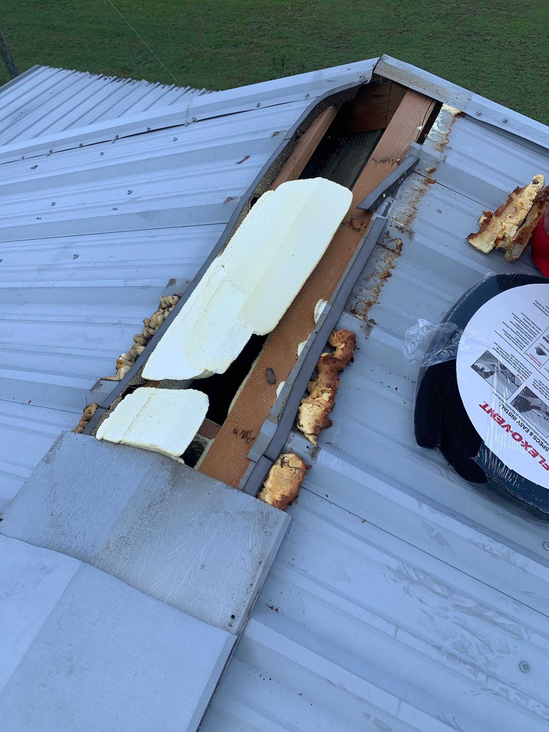 Repair work underway on a leaking metal roof in Dade City, Florida. The affected area was opened to locate the source of the leak and complete the necessary repairs.
