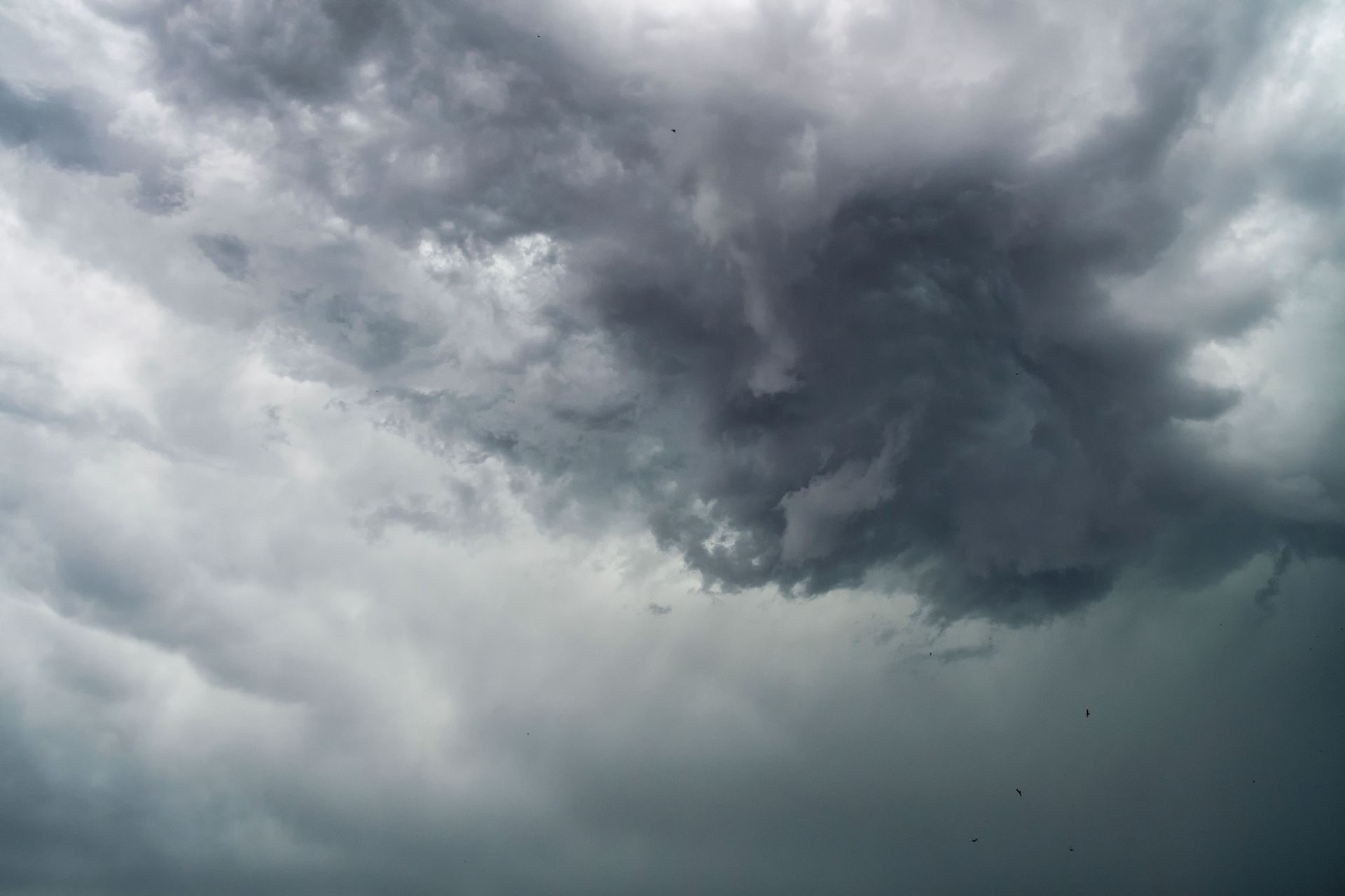 Dark storm clouds gathering over a gray sky
