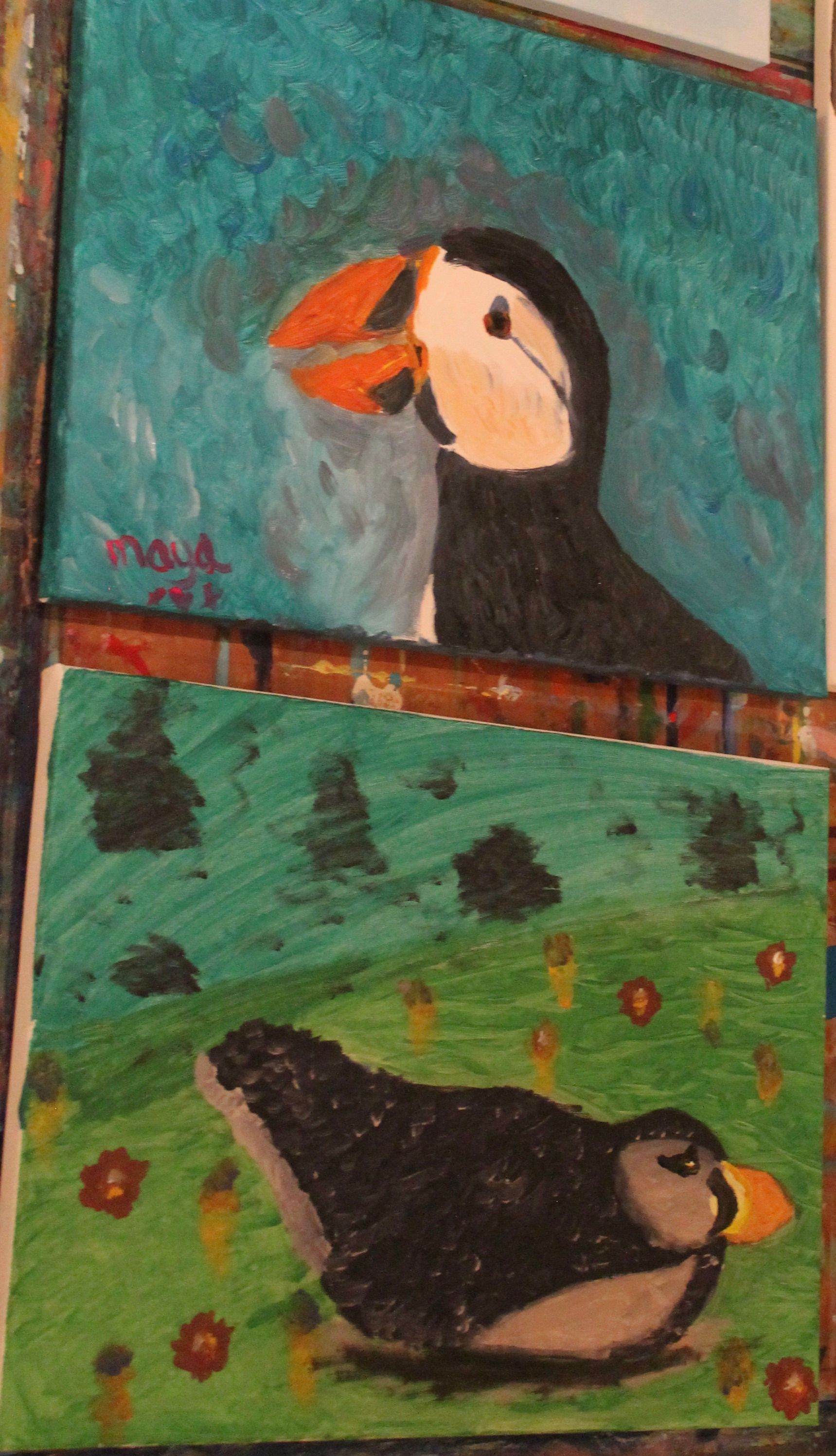 Een schilderij van een papegaaiduiker en een ander schilderij van een papegaaiduiker