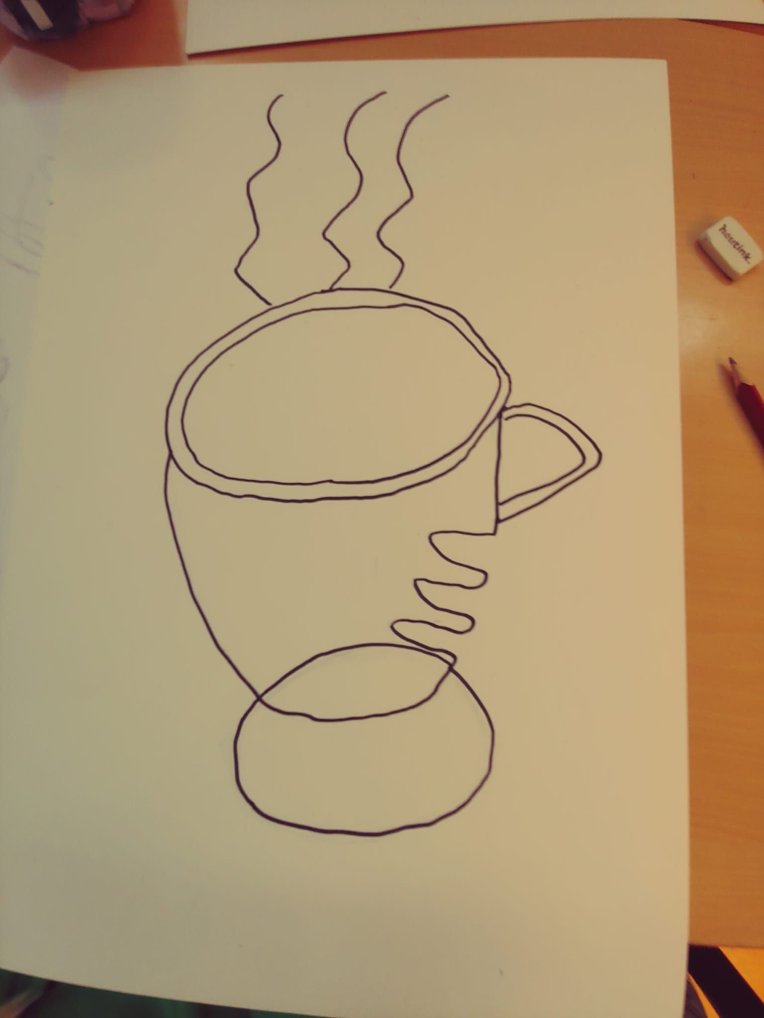 Een tekening van een kopje waar stoom uit komt