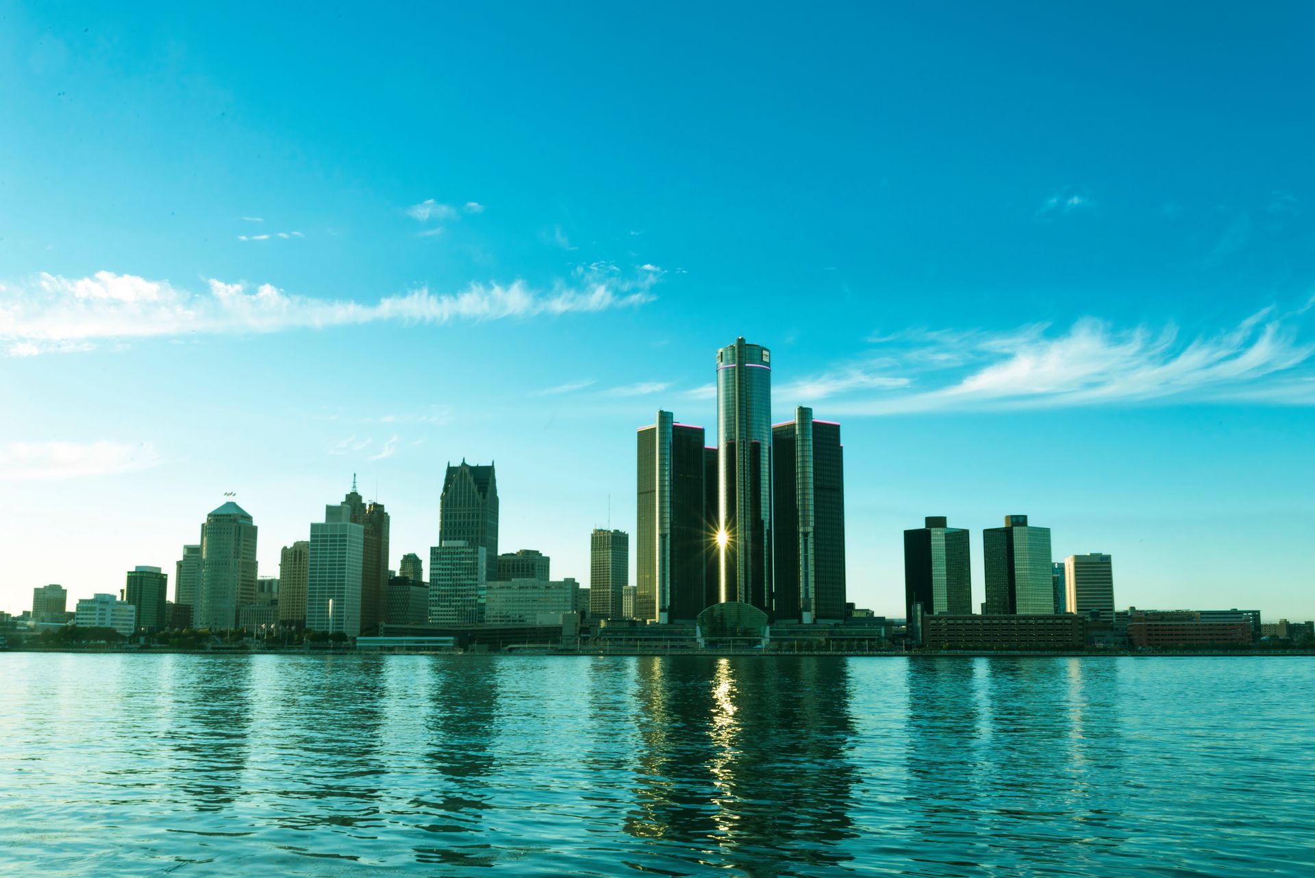 The Renaissance Center and downtown city skyline reflecting on the Detroit River in Detroit, Michigan