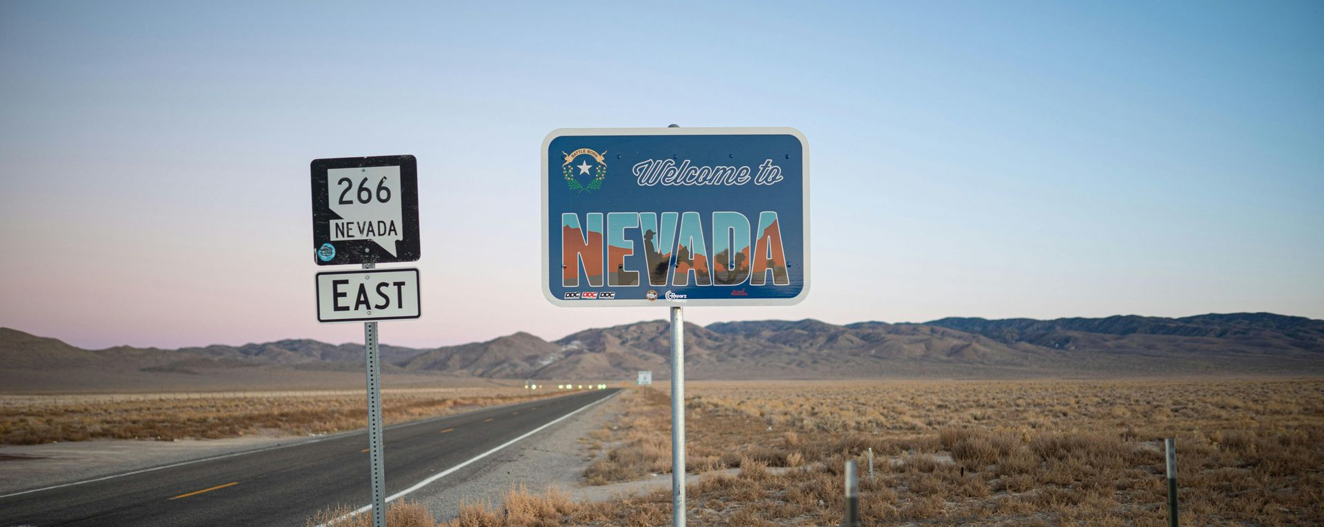 Welcome to Nevada highway sign along Route 266 in the Nevada desert