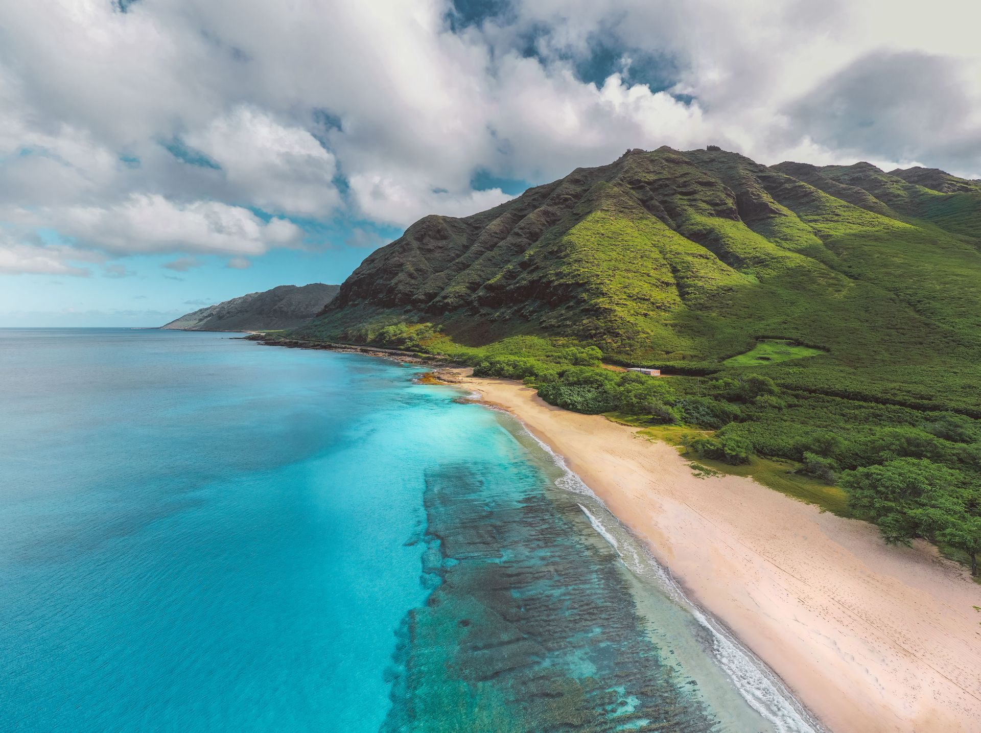 Aerial view of the pristine Makua Beach and the Waianae mountain range on Oahu, Hawaii
